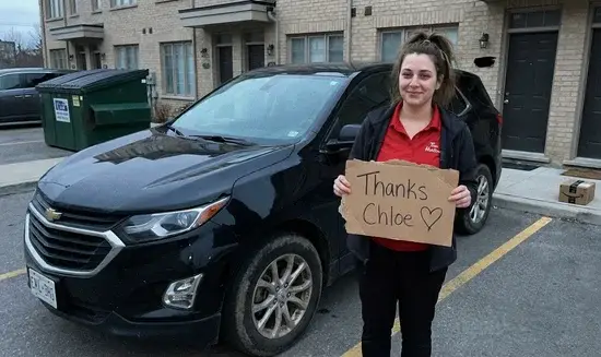 Amanda P. holding a Thank You Chloe sign
