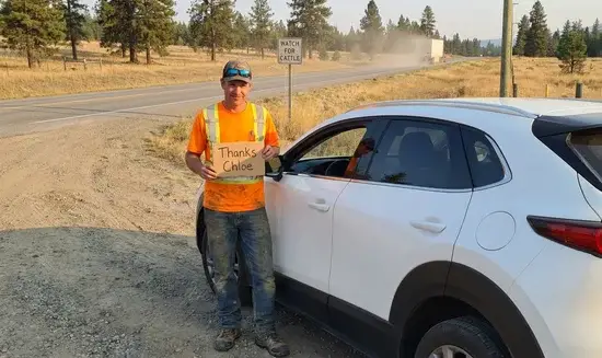 Anthony R. holding a Thank You Chloe sign