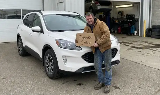 David M. holding a Thank You Chloe sign