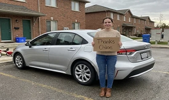 Diana L. holding a Thank You Chloe sign