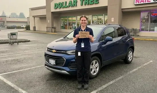 Donna F. holding a Thank You Chloe sign