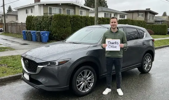 James T. holding a Thank You Chloe sign
