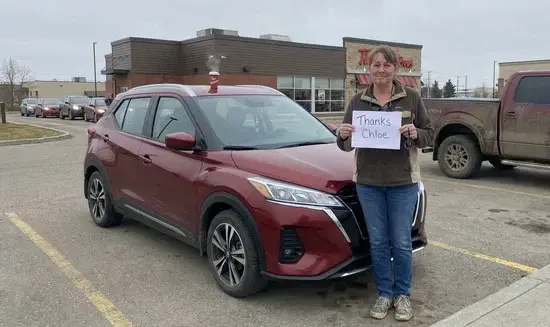 Linda S. holding a Thank You Chloe sign