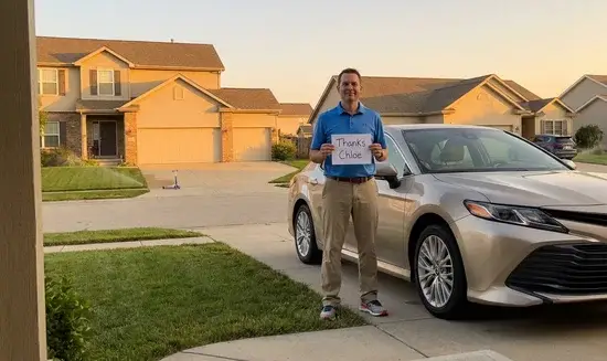 Mark J. holding a Thank You Chloe sign
