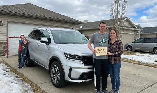 Robert K. holding a Thank You Chloe sign