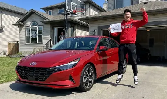 Tyler A. holding a Thank You Chloe sign