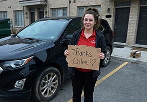 Amanda P. with their vehicle