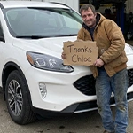 David M. with their vehicle