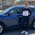 Jessica H. with their vehicle